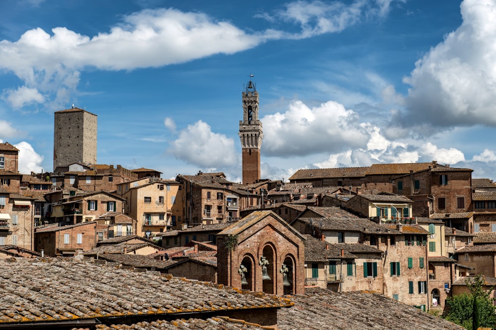 a view of a city with a clock tower in the background