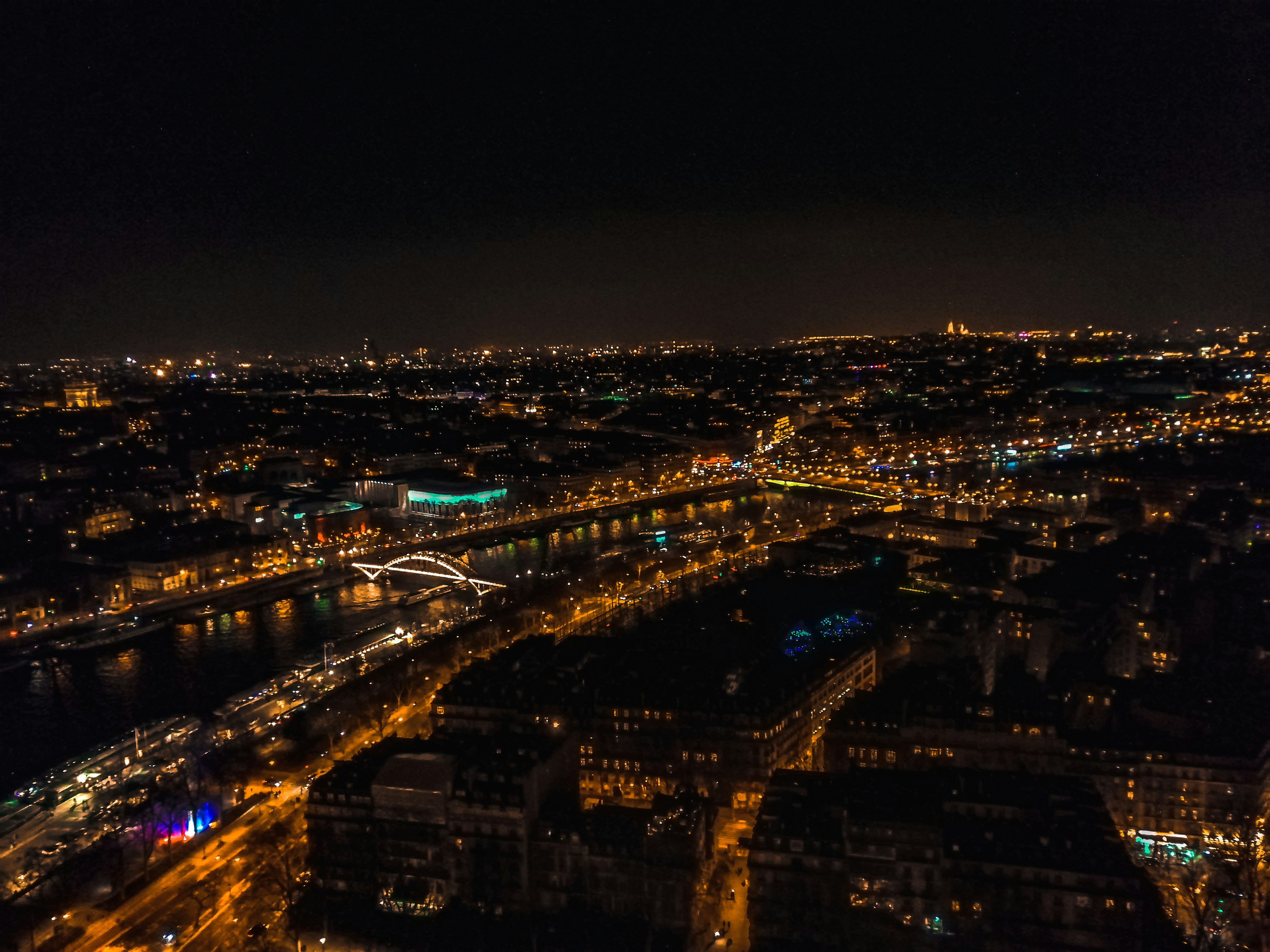 an aerial view of a city at night, View from the Eiffel