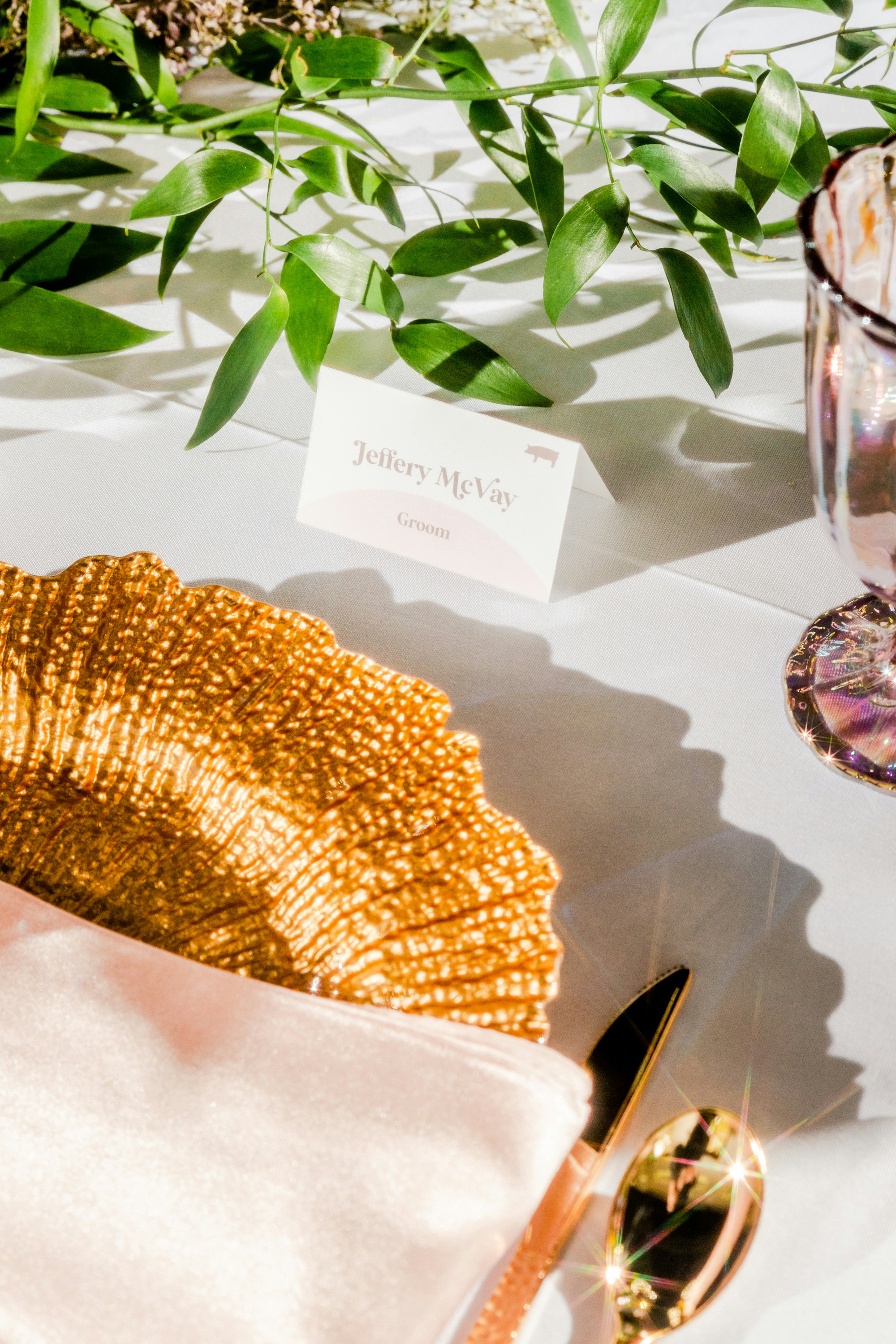 a table with a place setting and a place card