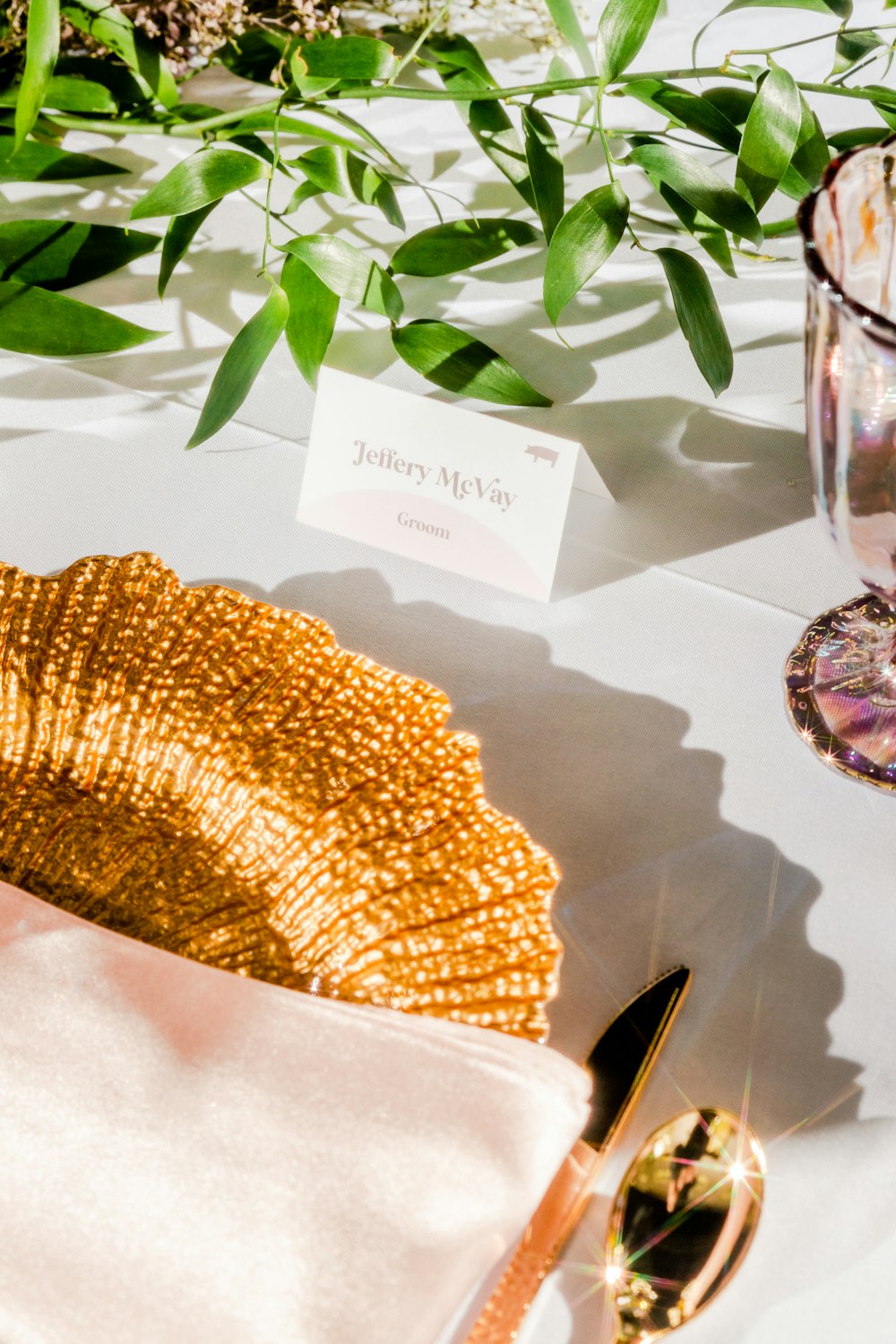 a table with a place setting and a place card