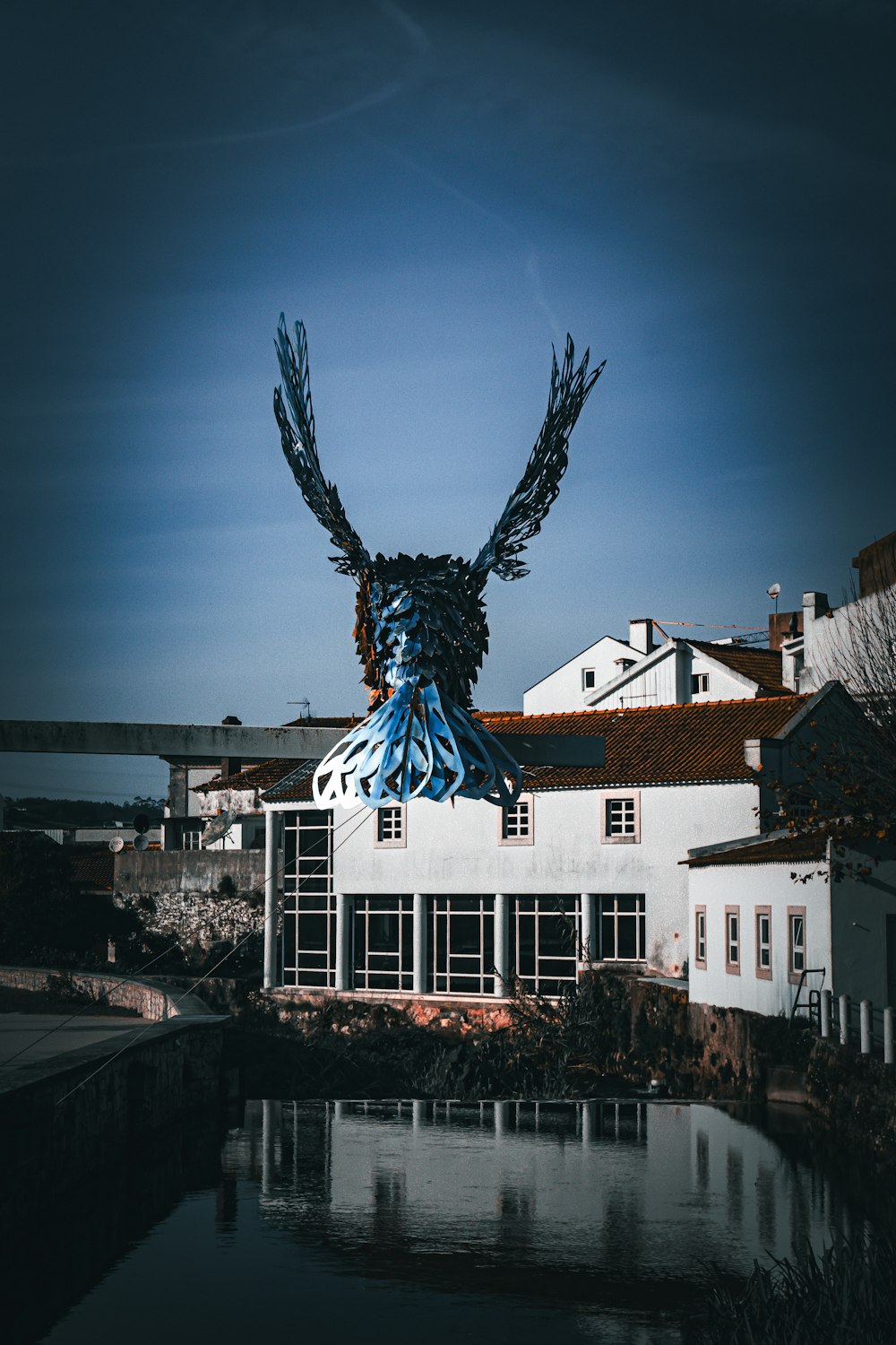 a building with a bird sculpture on top of it