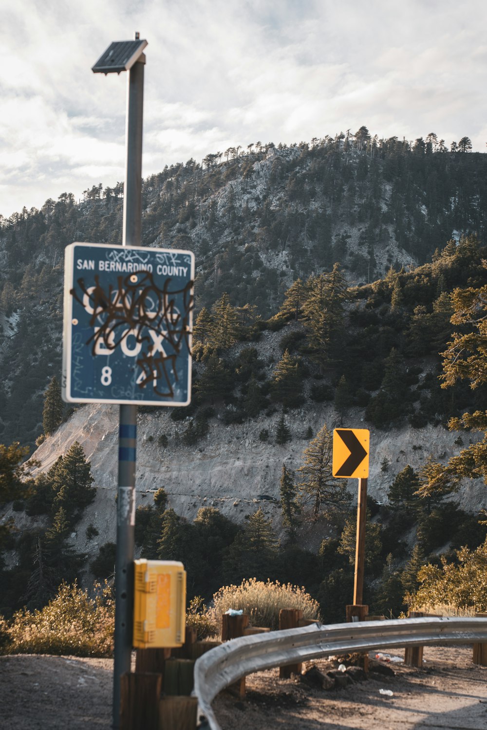 a street sign on the side of a road