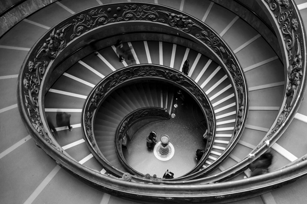 a black and white photo of a spiral staircase