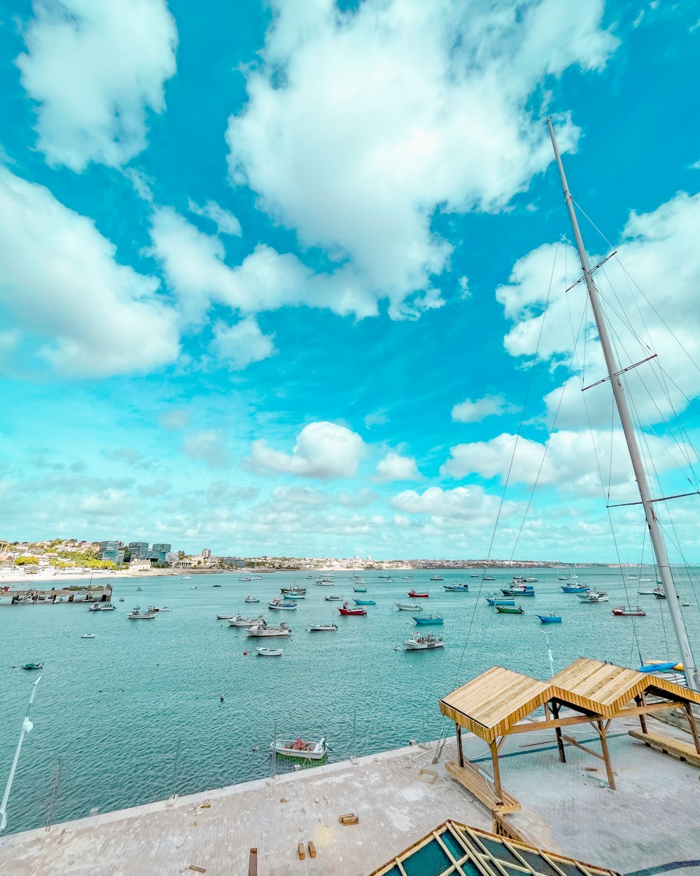 a harbor filled with lots of boats under a blue sky