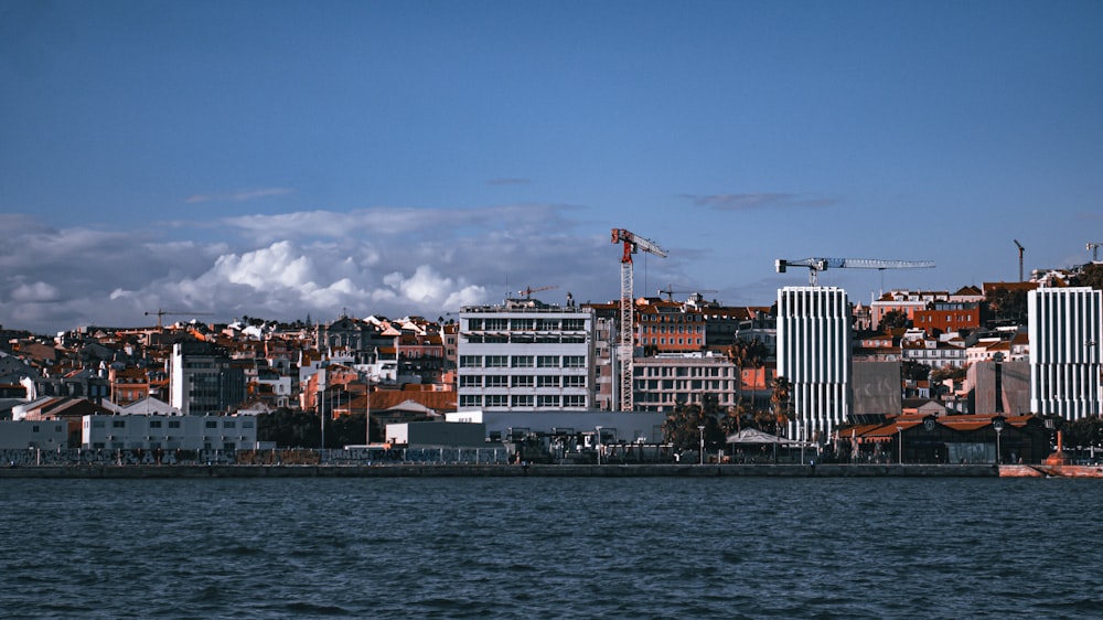 a large body of water with a city in the background