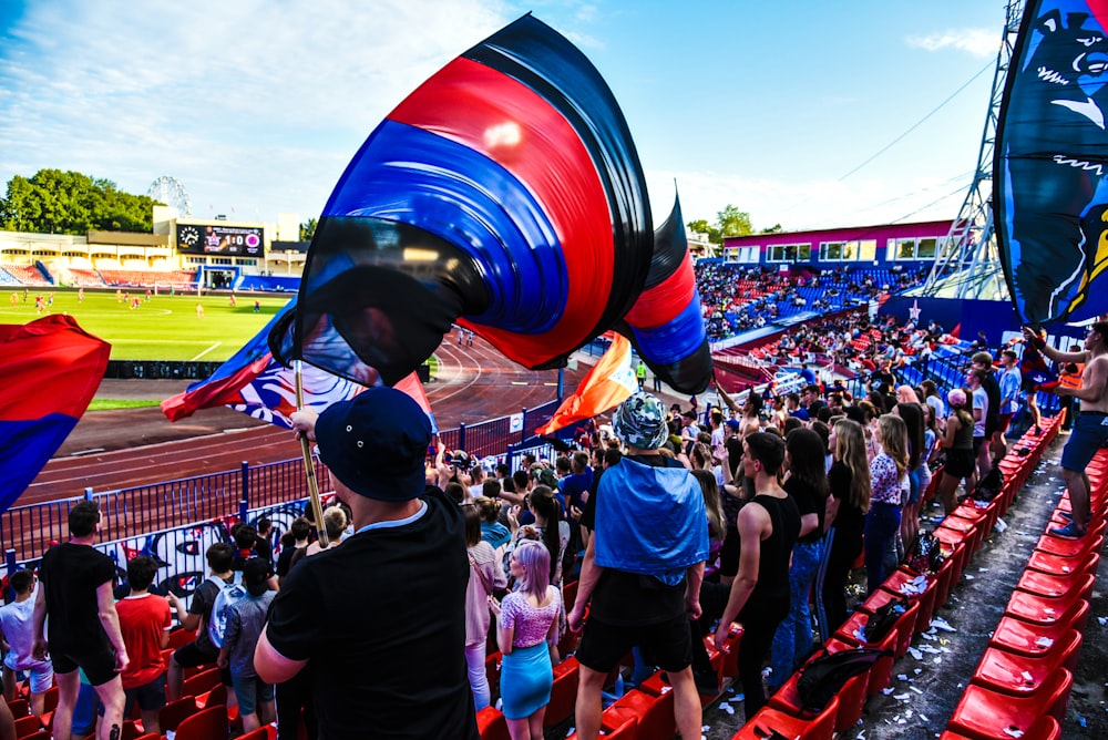 a group of people standing in a stadium