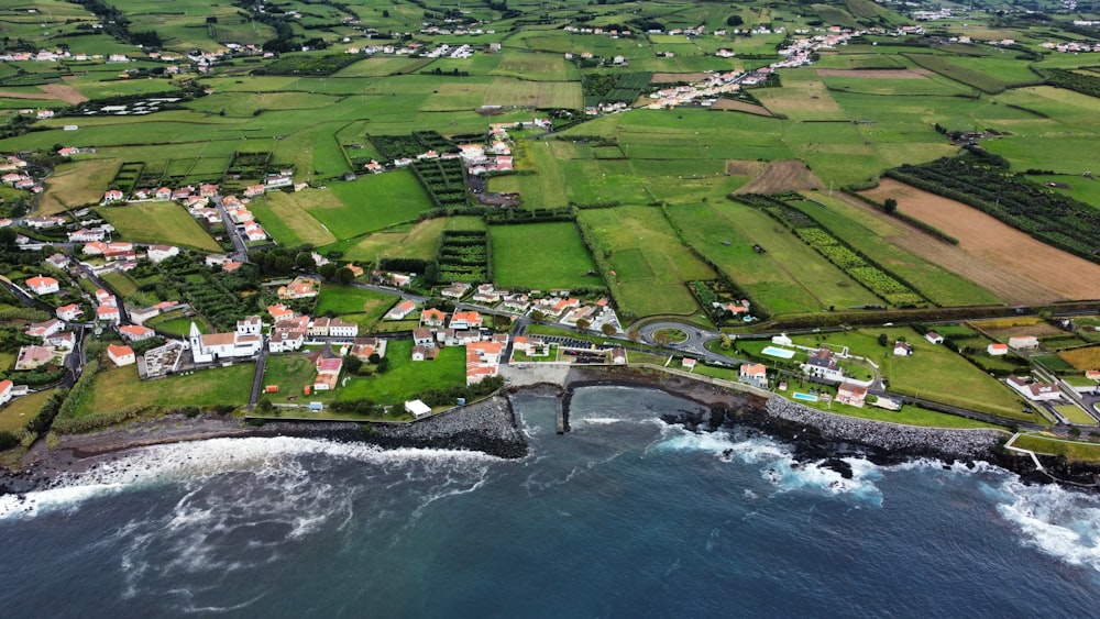 an aerial view of a small town by the ocean