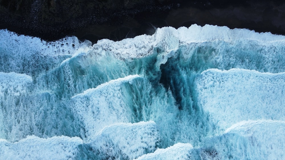 a large waterfall of water that has ice on it