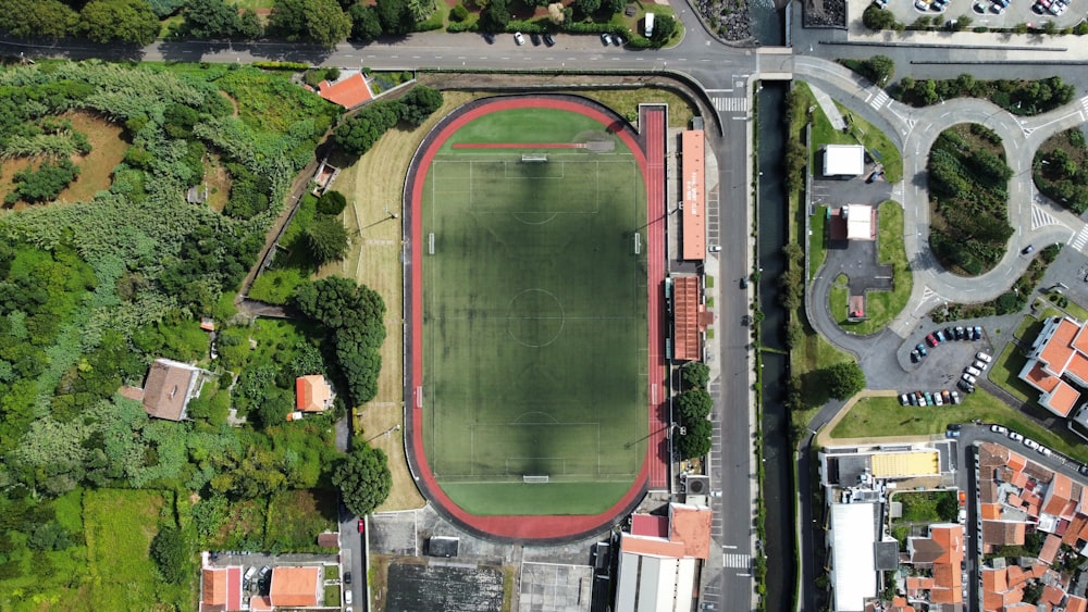 an aerial view of a soccer field in a city