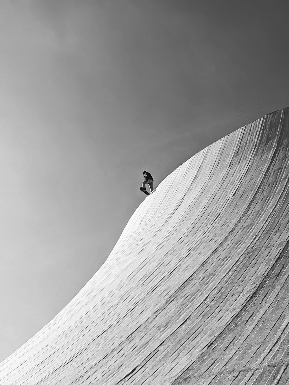 a man riding a skateboard down the side of a ramp