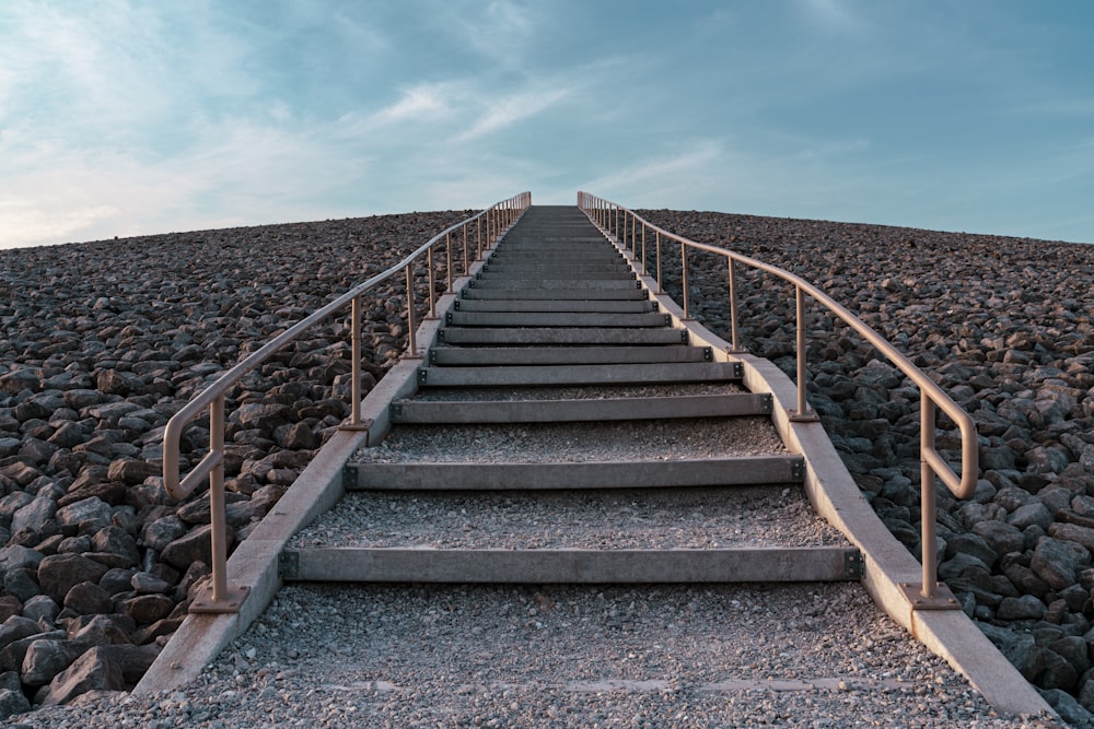 a set of stairs leading up to the top of a hill