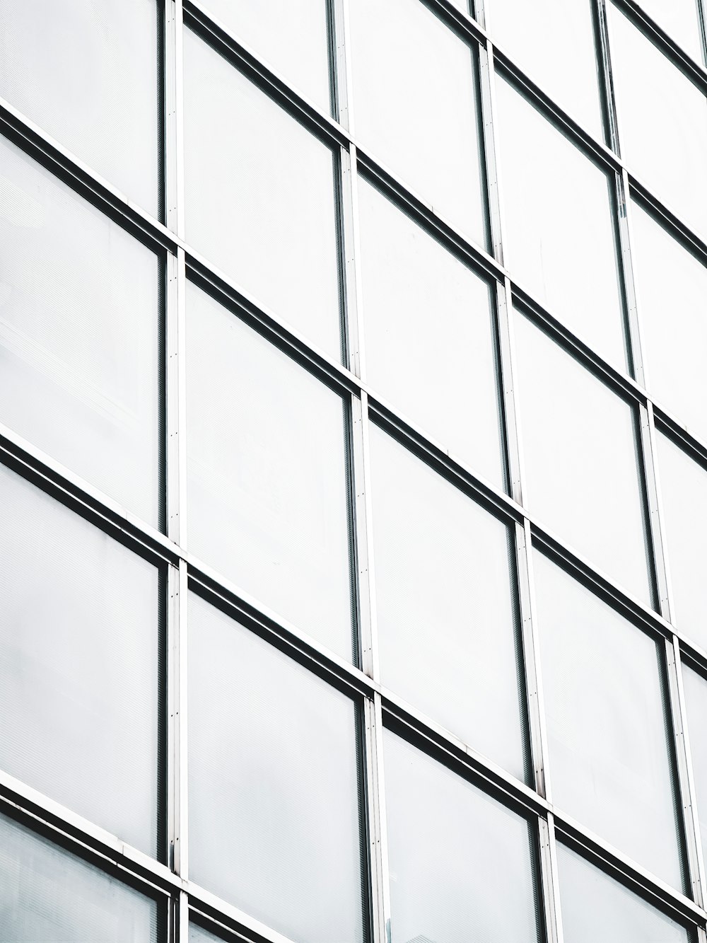 a clock on the side of a tall building