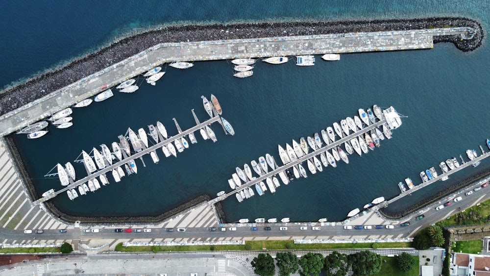 an aerial view of a marina with boats docked