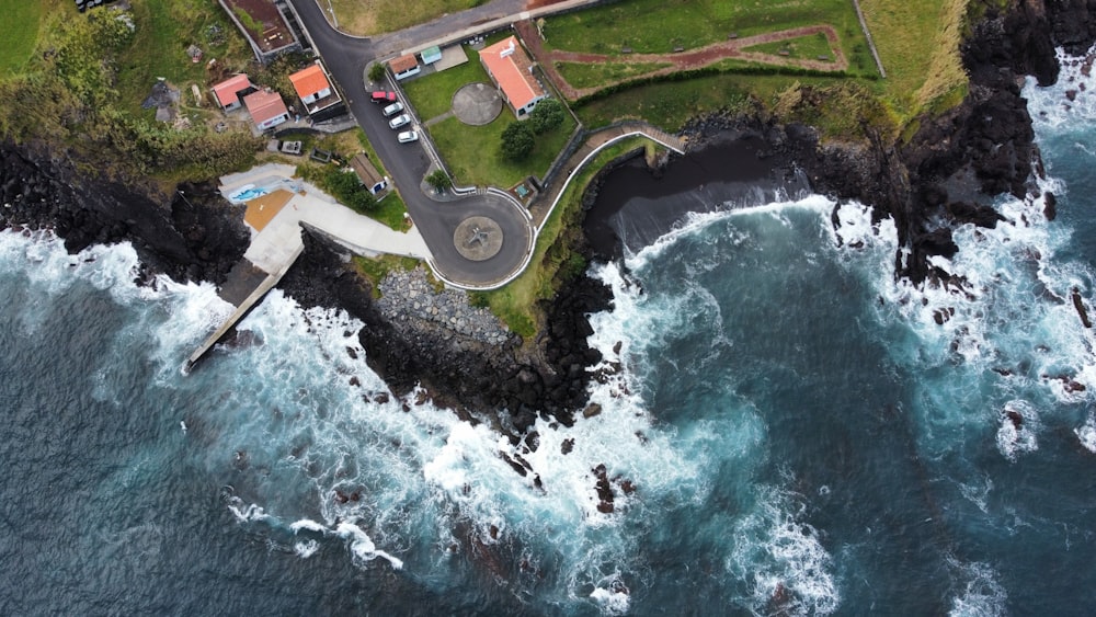 an aerial view of an island with a road going through it