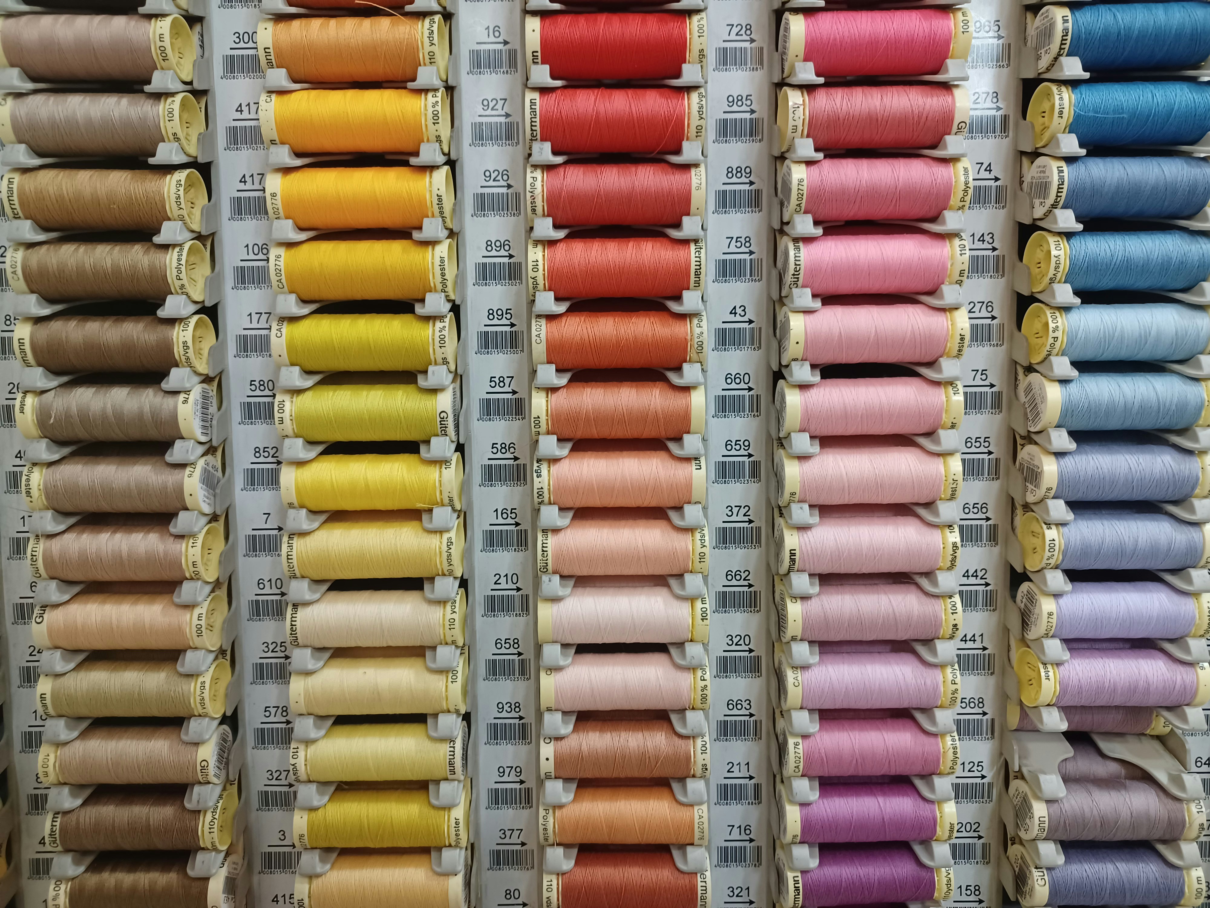 rows of spools of thread in a store