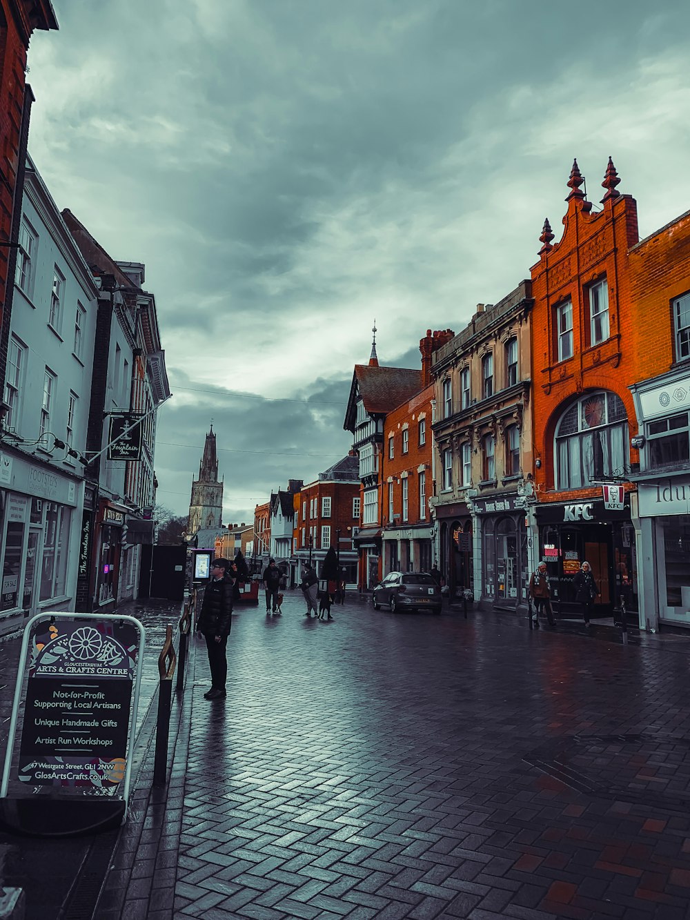 a person walking down a street in a city