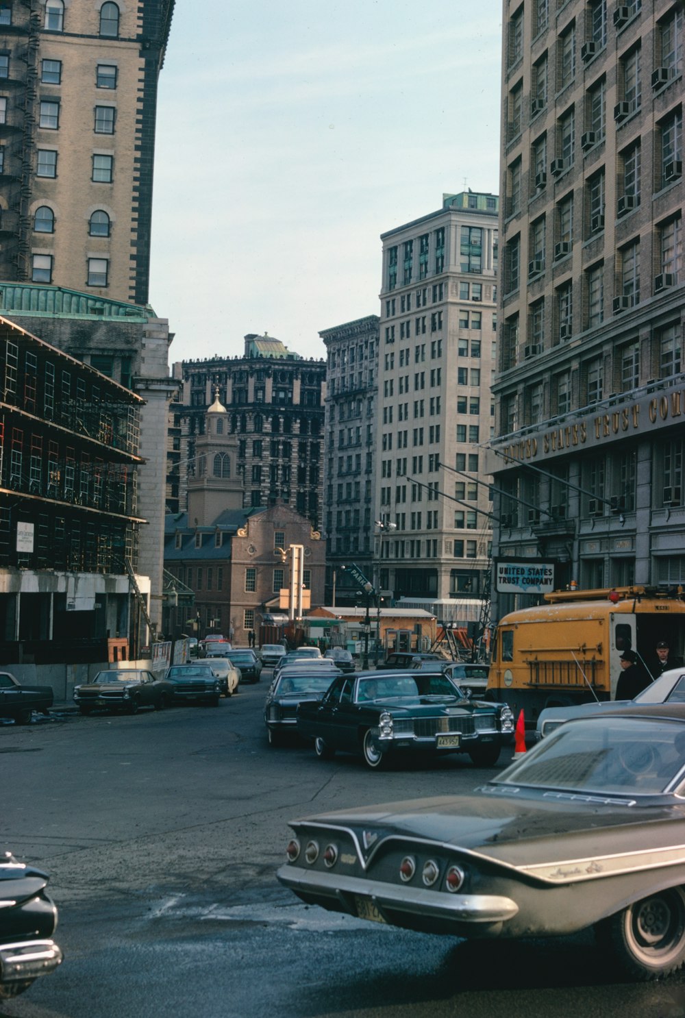 a city street filled with lots of tall buildings