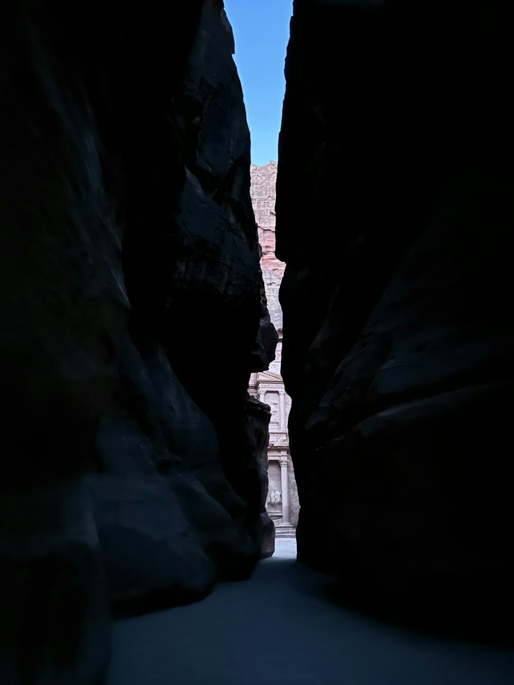 a narrow narrow passage between two large rocks