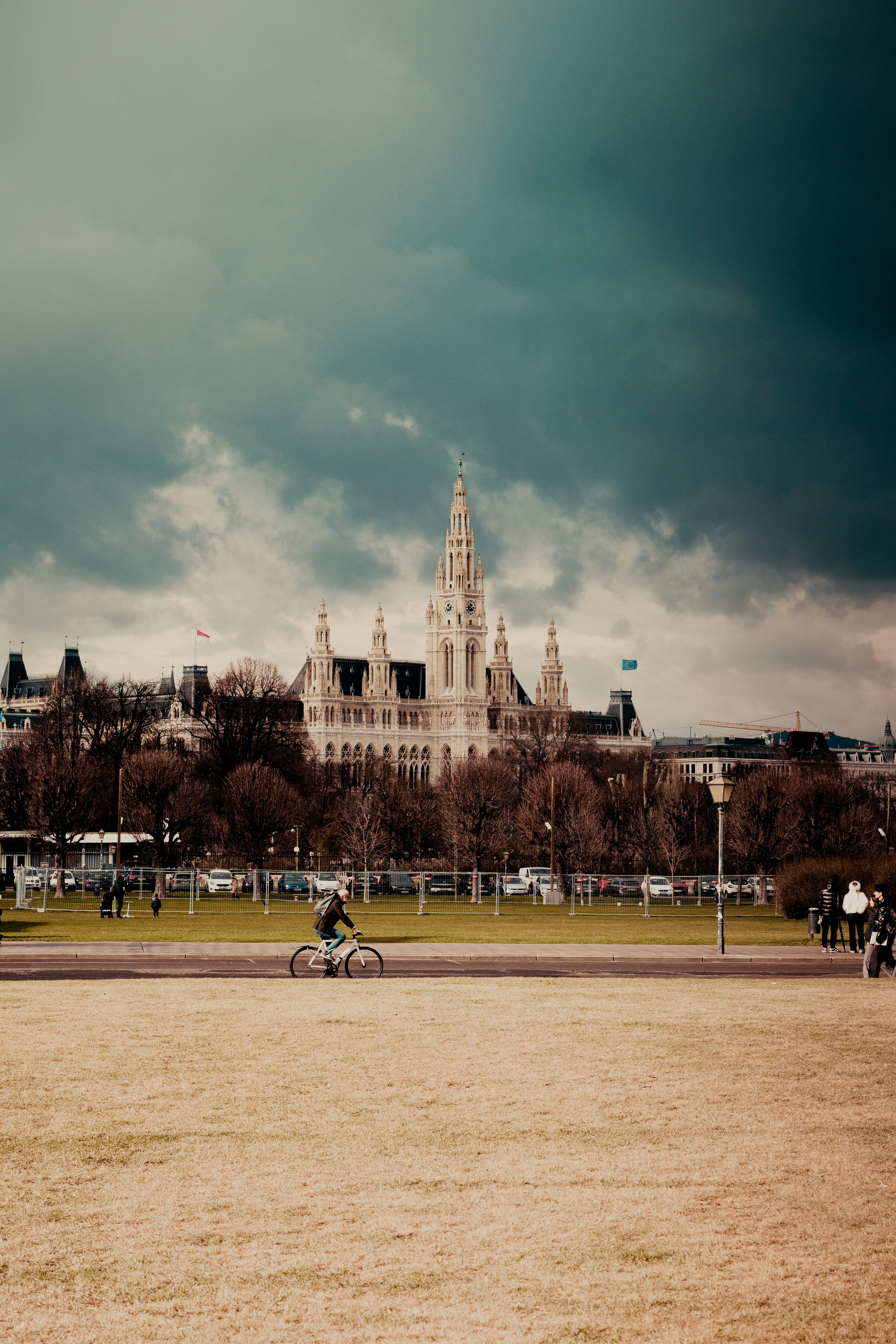 a man riding a bike down a dirt road