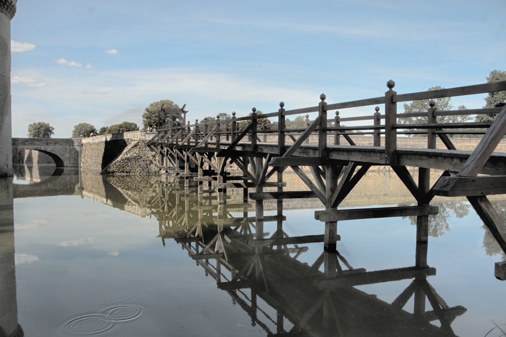 a wooden bridge over a body of water