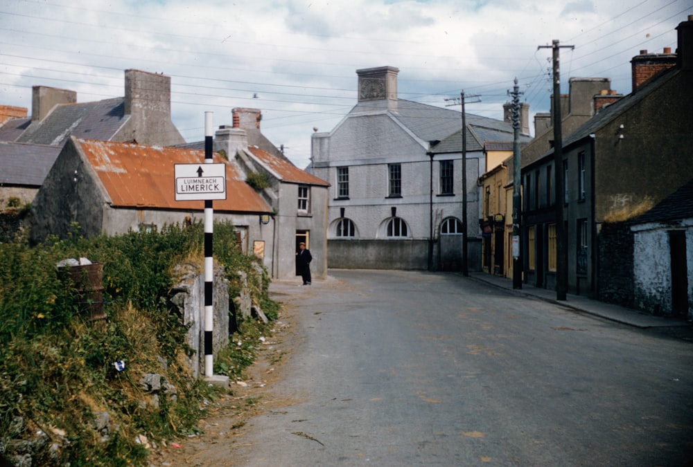 a person walking down a street in a small town