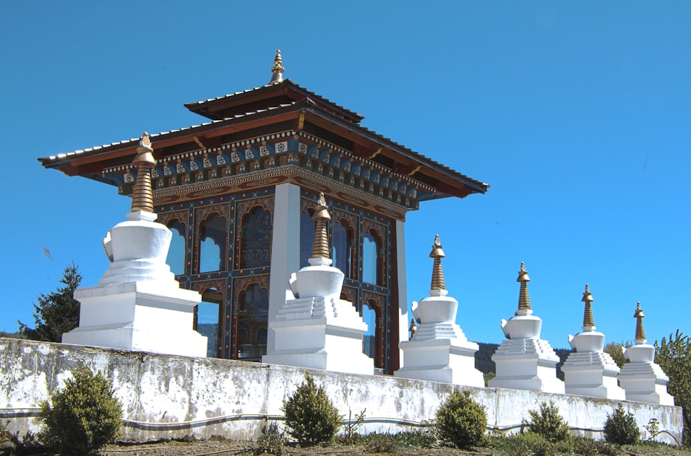 a white building with a bell tower on top of it