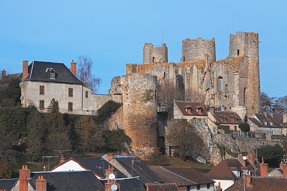 a view of a city with a castle in the background