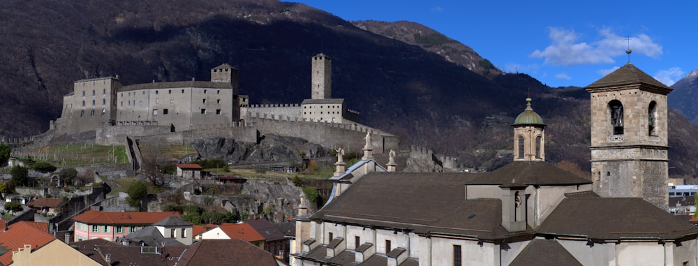 a view of a city with a castle in the background