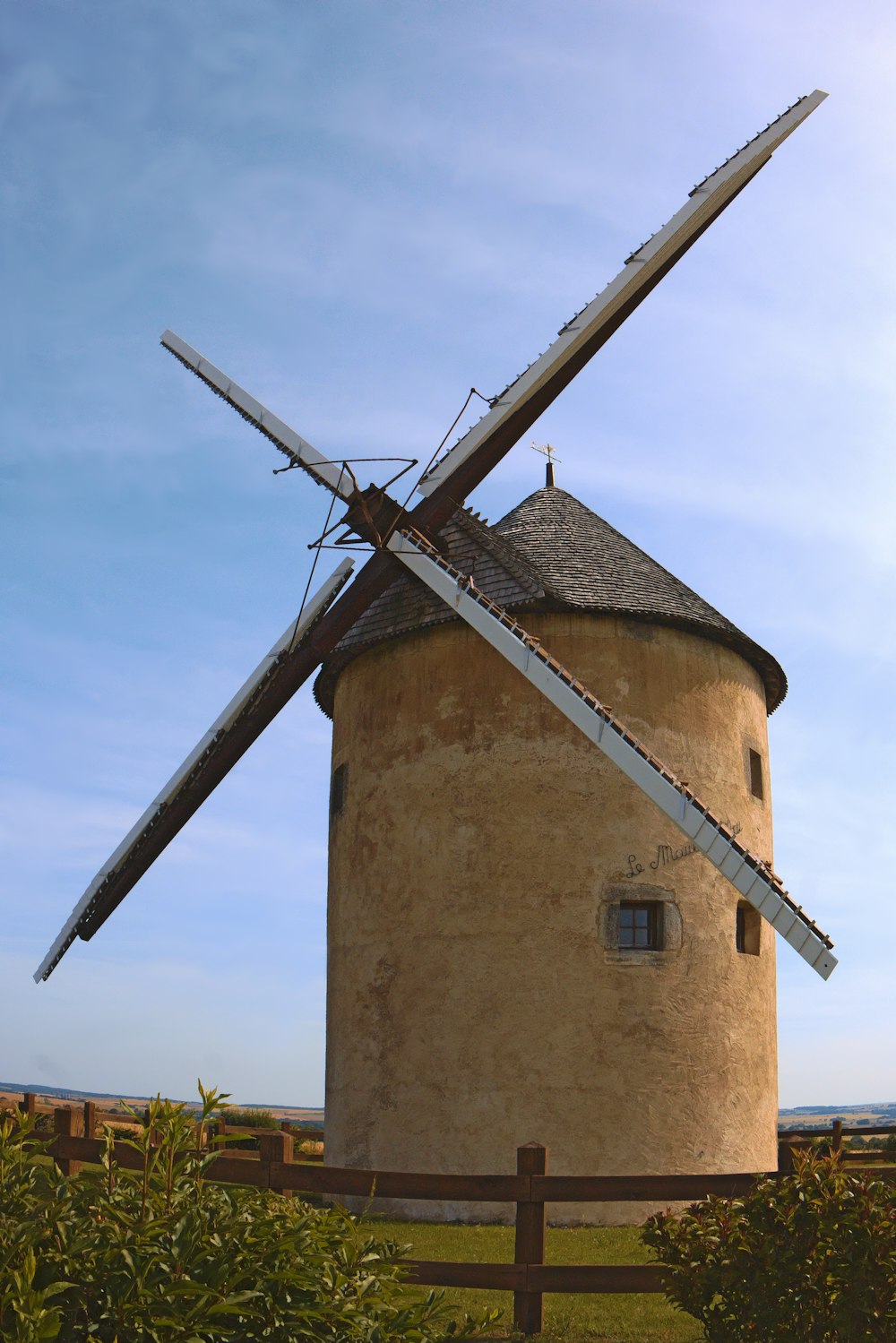 a windmill with a wind indicator on top of it