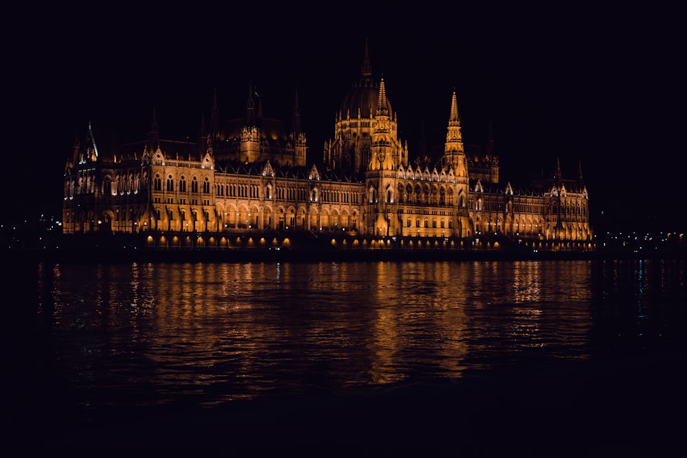 a large castle lit up in the night