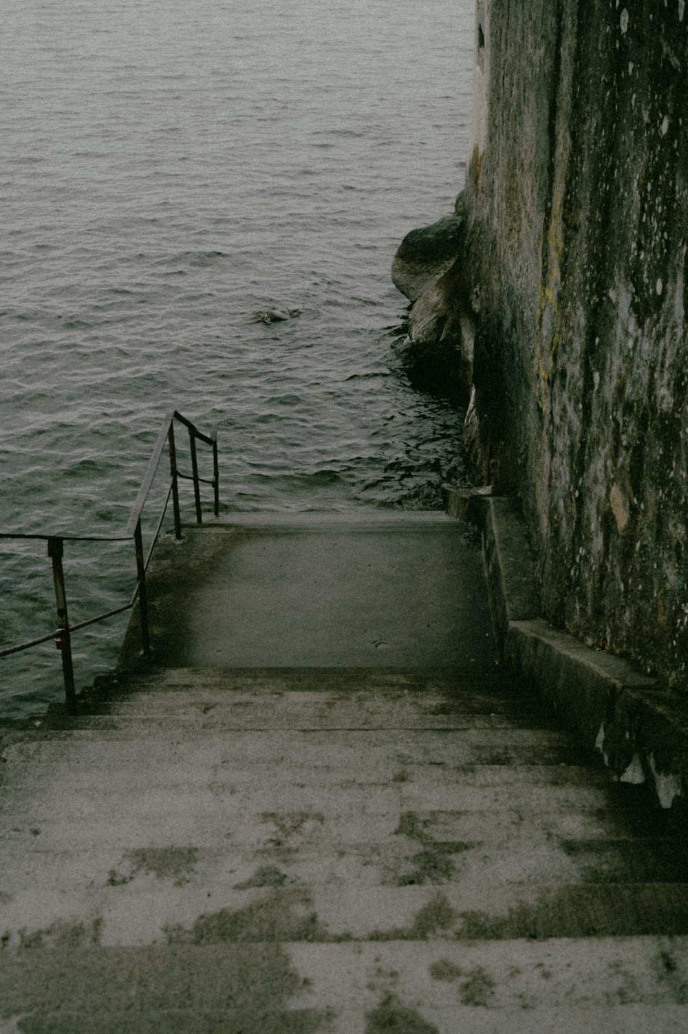 a stairway leading to a body of water