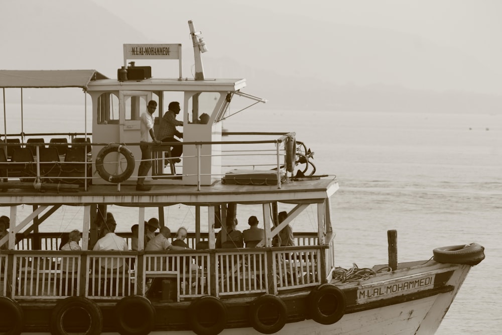 a black and white photo of a boat on the water