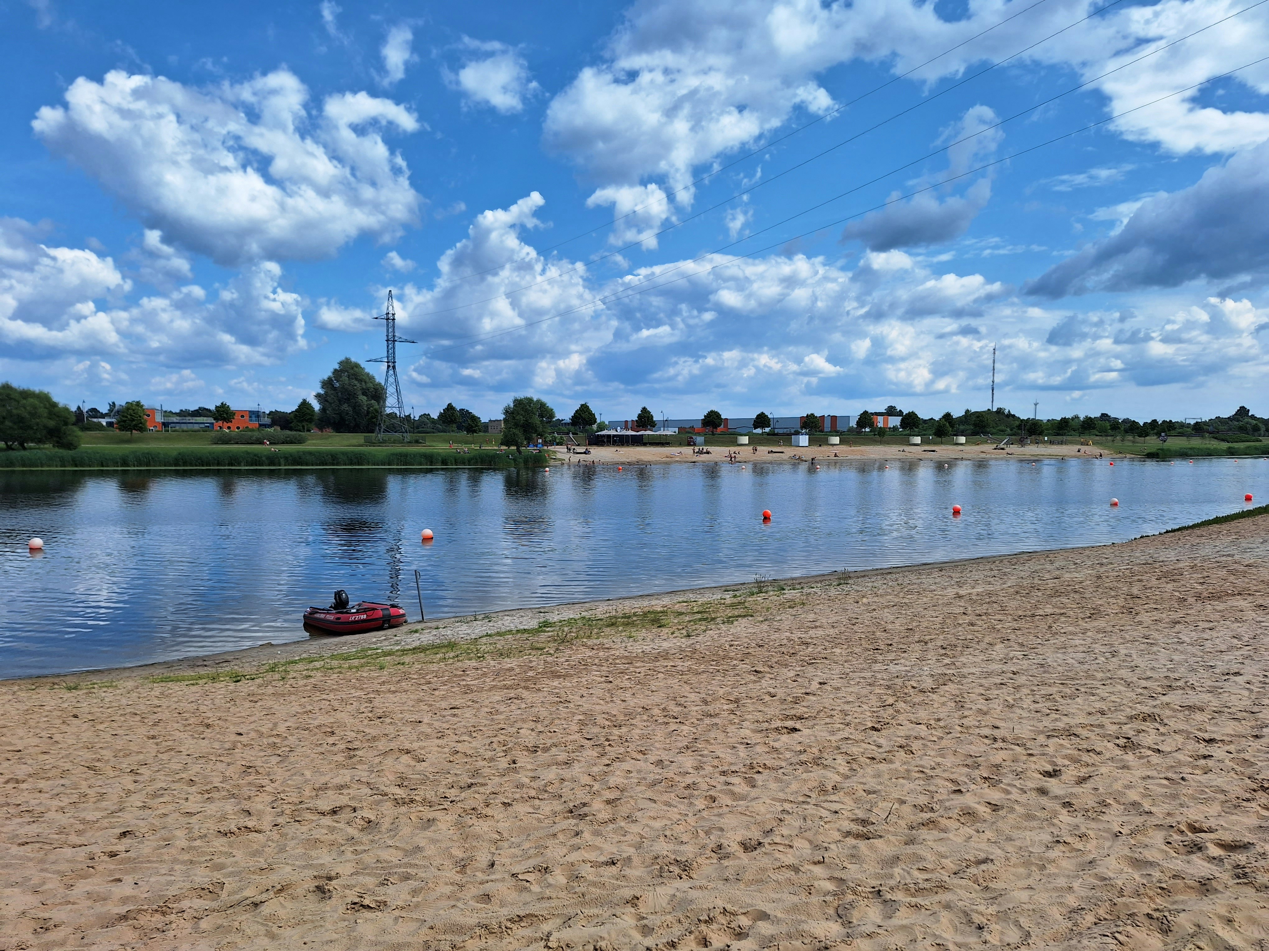 a small boat on the shore of a lake