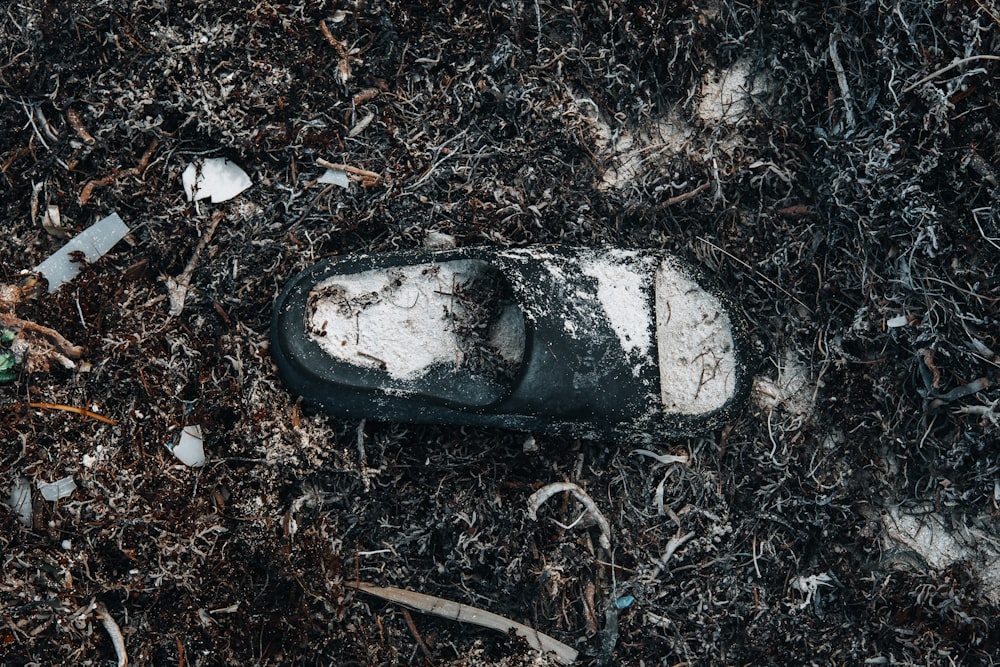 a dirty pair of shoes left on the ground