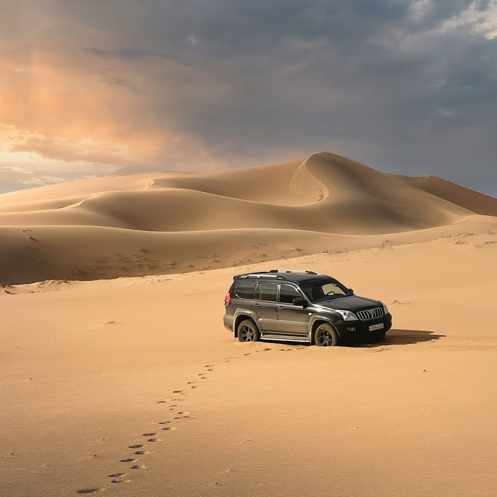 a vehicle is parked in the middle of the desert