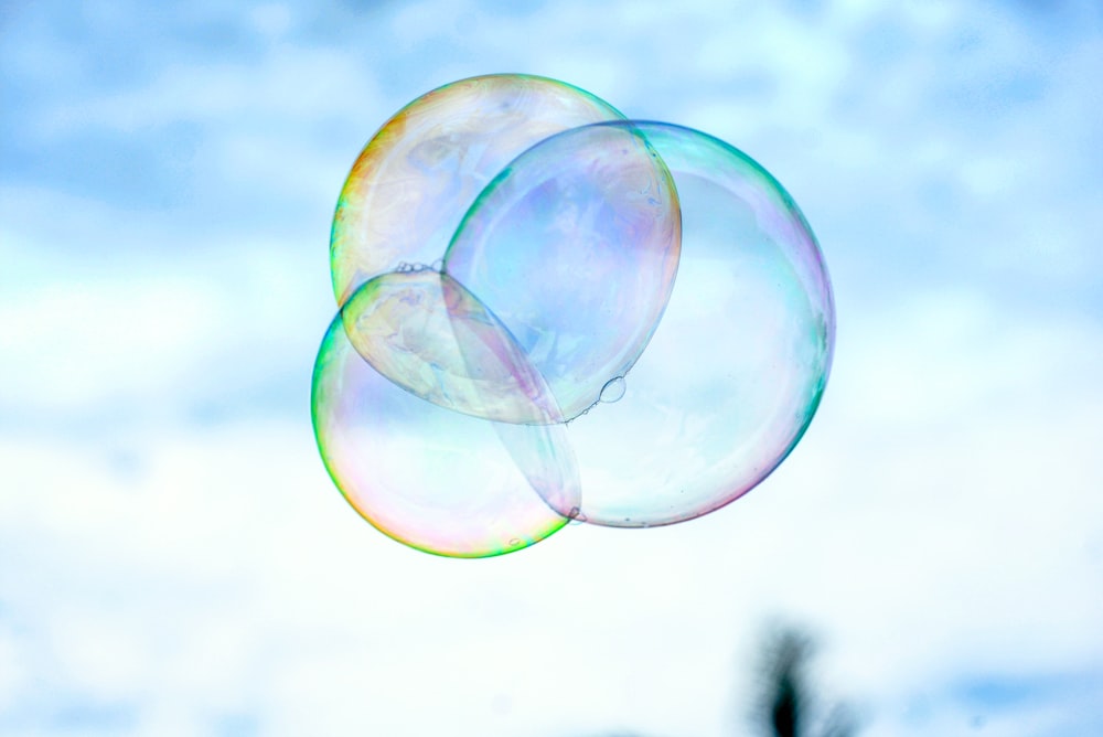 a couple of soap bubbles floating in the air