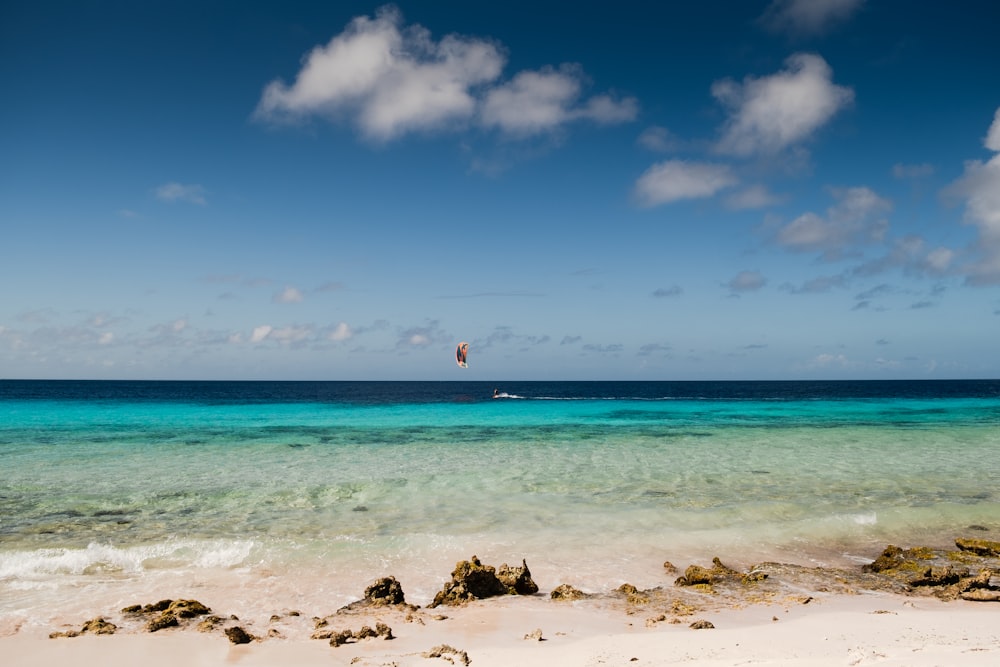 a sailboat is in the distance on a clear day