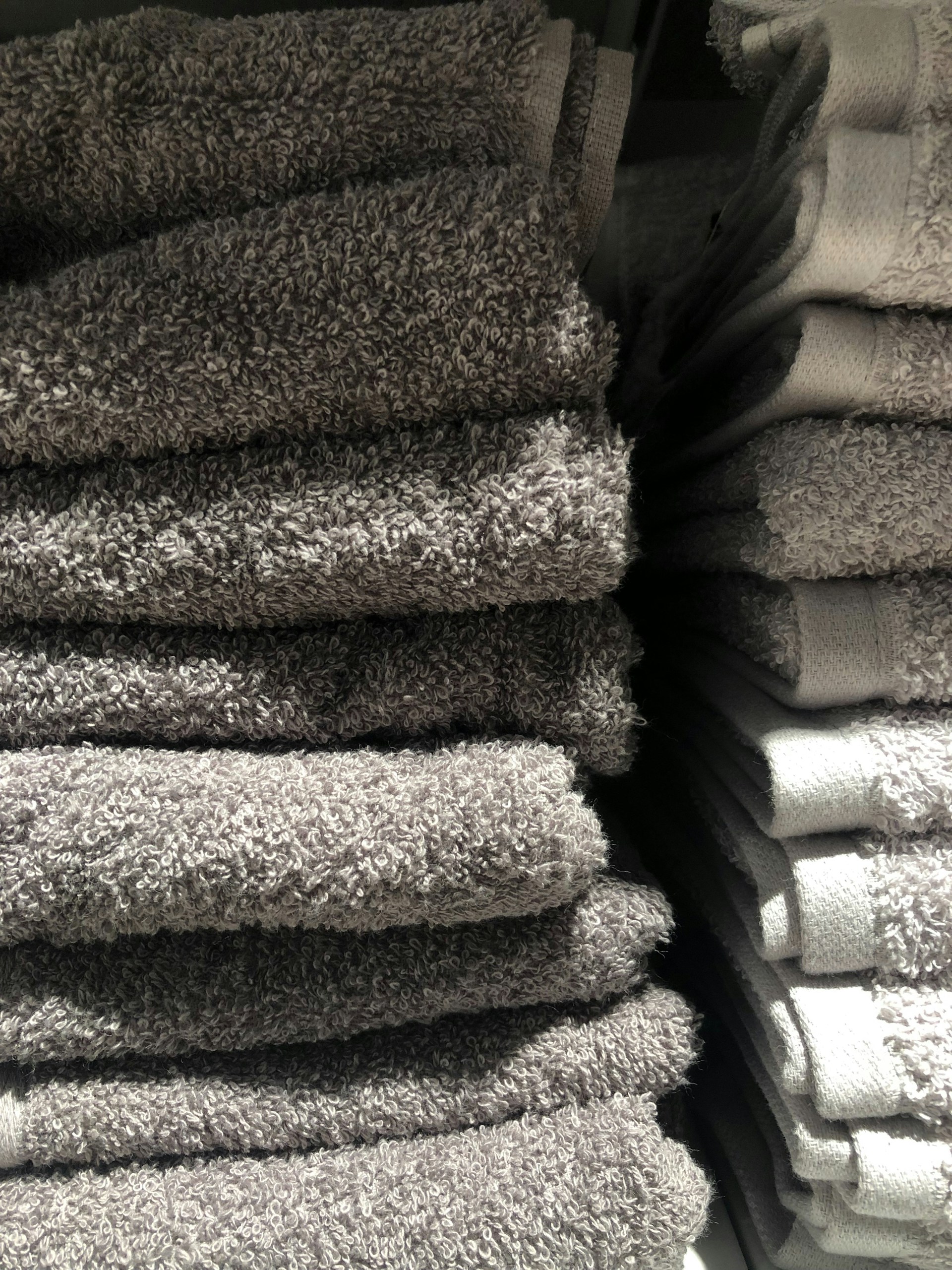 a pile of towels stacked on top of each other
