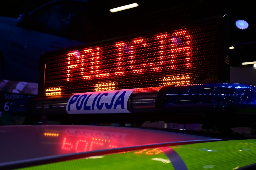 a close up of a police car sign