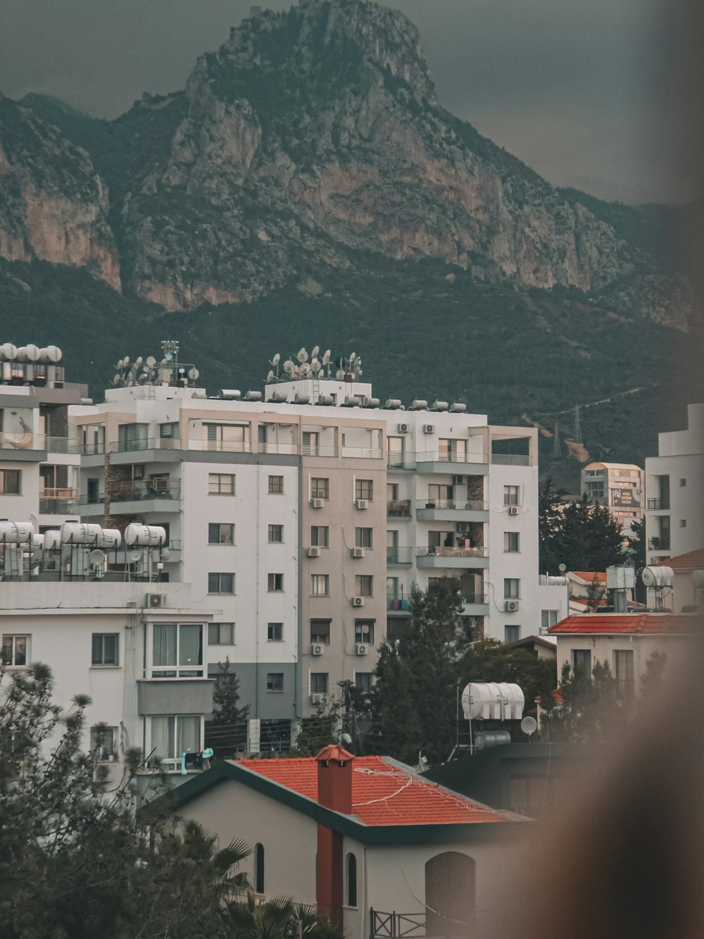 a view of a city with a mountain in the background