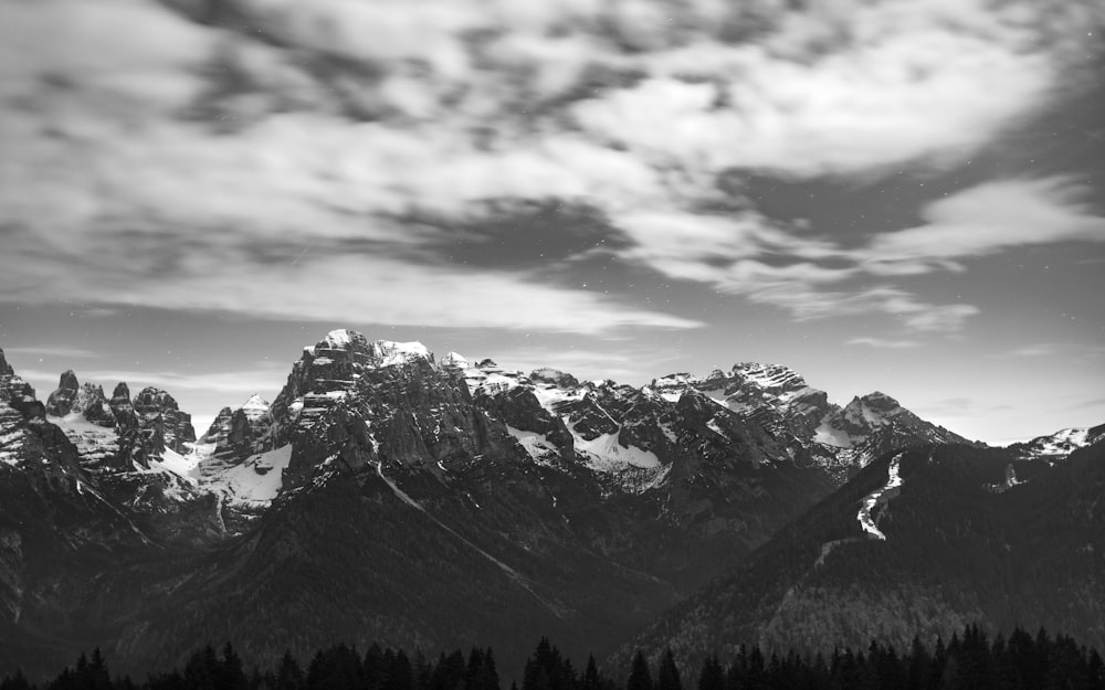 a black and white photo of a mountain range