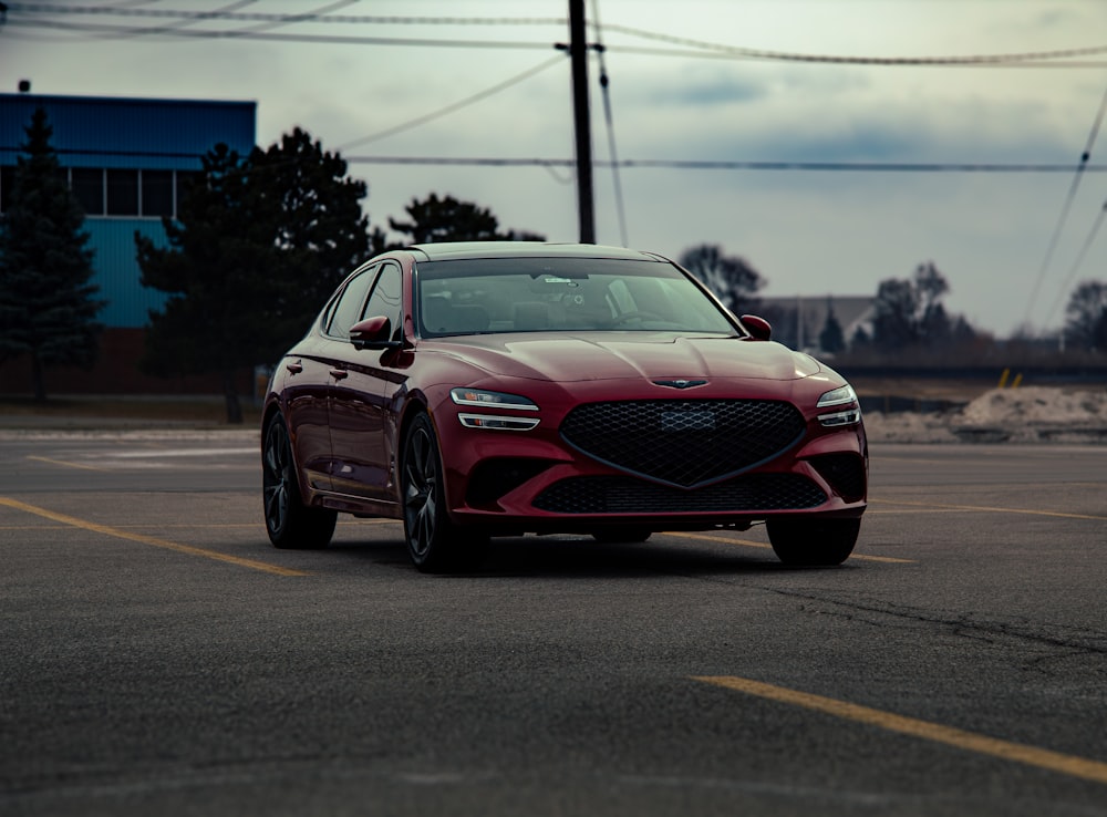 a red car parked in a parking lot