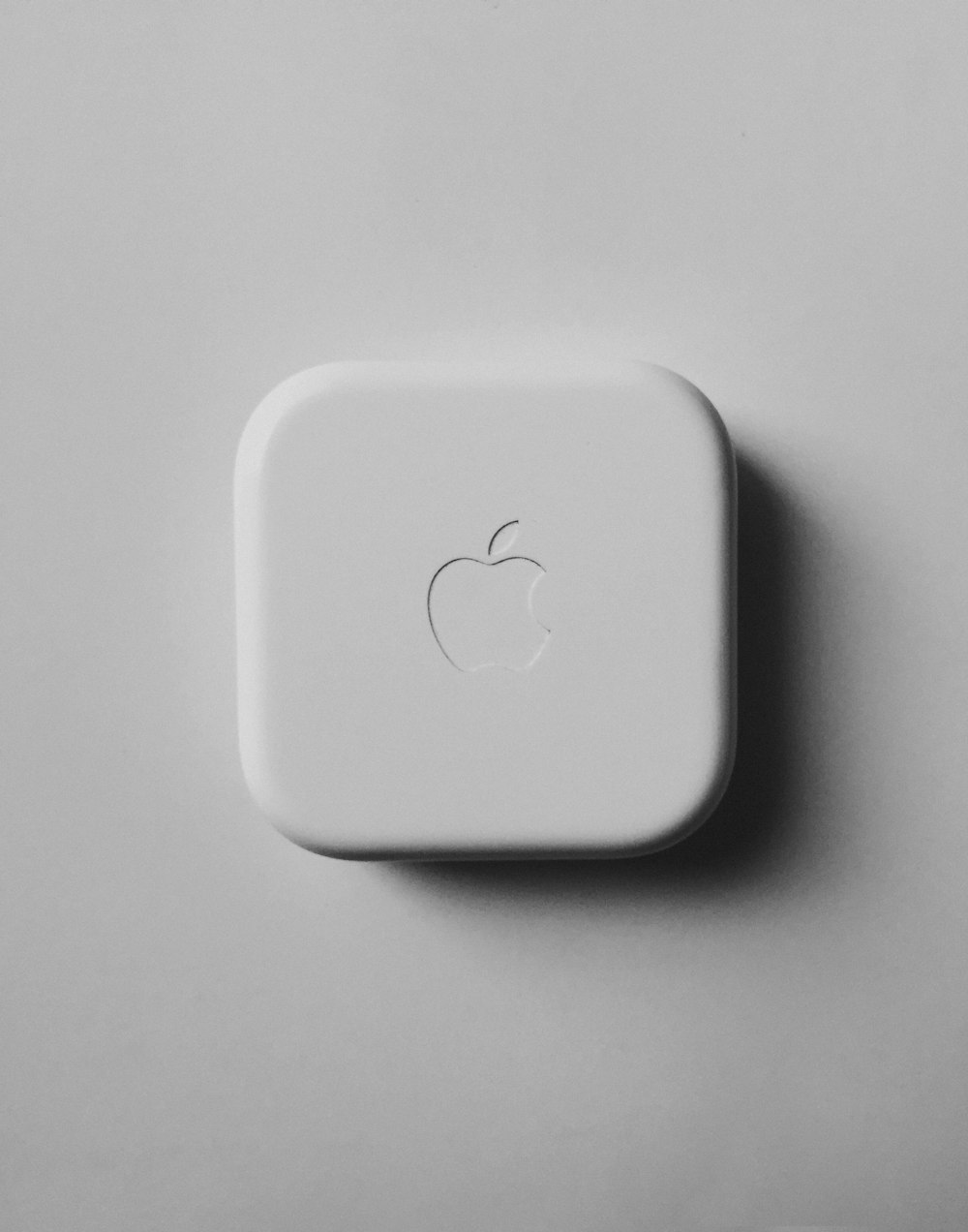 an apple logo is shown on a white surface