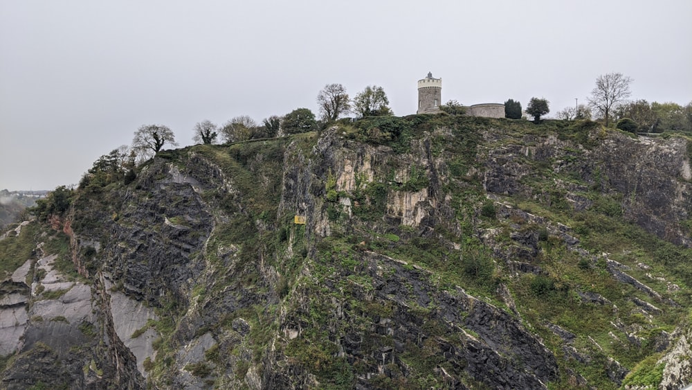 a large hill with a tower on top of it