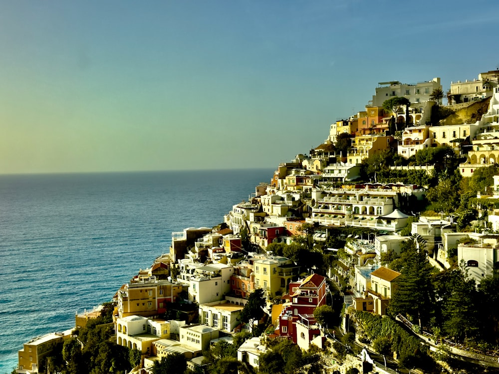 a view of a hillside with houses on top of it