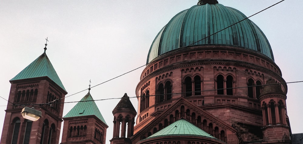 a large building with a green dome on top of it