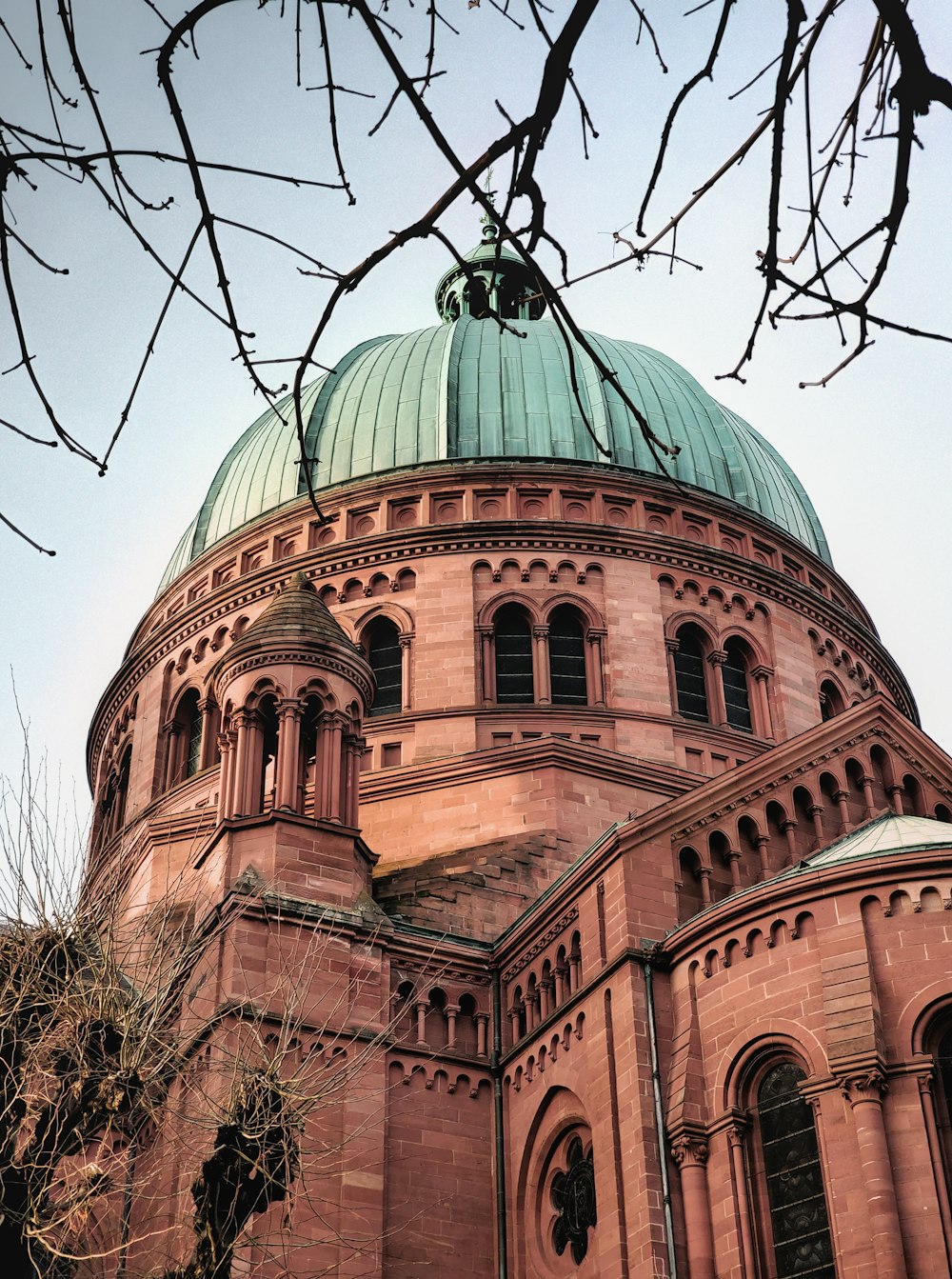 a large building with a green dome on top of it