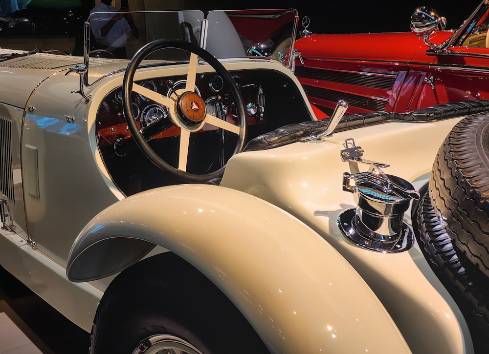 a vintage car is on display at a car show