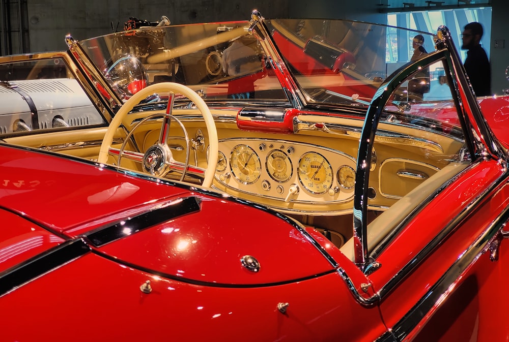 a red car with a yellow steering wheel