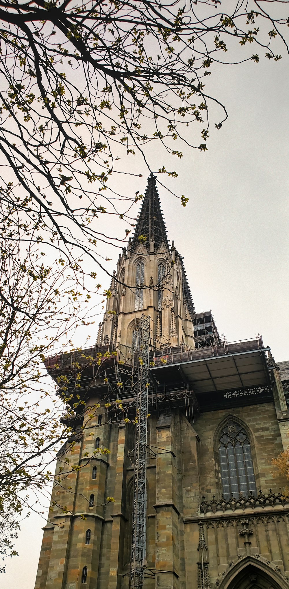 a tall tower with a clock on it's side